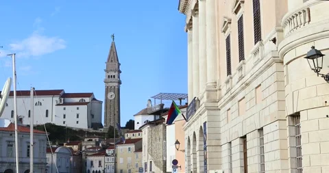 View on main square, old buildings with flag, Church and bell tower Stock Footage 130358891