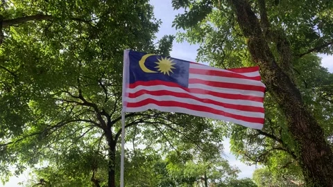A view of the Malaysian flag flying in conjunction with the independence Stock Footage 343490836