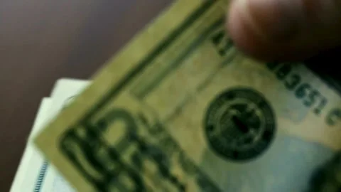 View of male hands counting stack of dollars bills. dollar cash money exchange, Stock-Footage 336264216