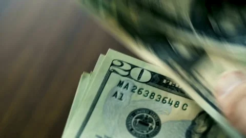 View of male hands counting stack of dollars bills. dollar cash money exchange, Stock-Footage 336264357