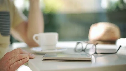 View of male's hands touching screen on smartphone while browsing internet, stea Stock-Footage 76990535