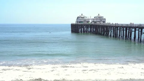 View of Malibu Pier, ocean waves in sunny day Stock Footage 153039770