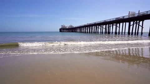 View of Malibu Pier, ocean waves in sunny day Stock Footage 153039788