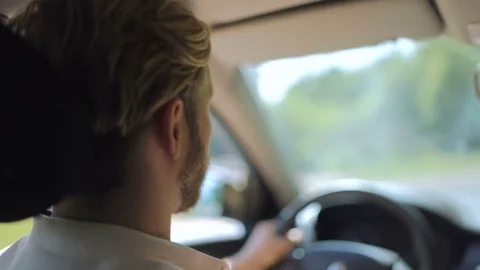 View of the man from the back who is driving a car Stock Footage 82826388