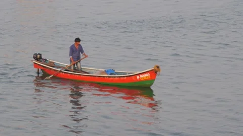 View of man changing boat direction Stock-Footage 150718753