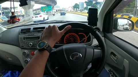 A view of man driving a car slowmotion in 4k Stock Footage 158760096