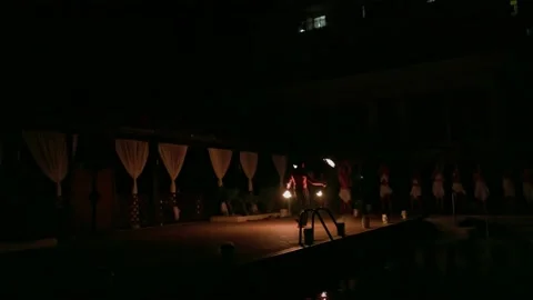 View of man with entertainment night program fire show in front of tourists. Stock Footage 203267991