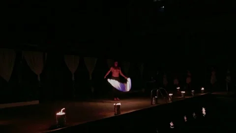 View of man with entertainment night program fire show in front of tourists. Stock Footage 221512694