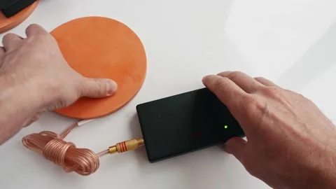 Up view of man hands fixing assembling parts of Mishin coil to start treatment Stock Footage 151507623