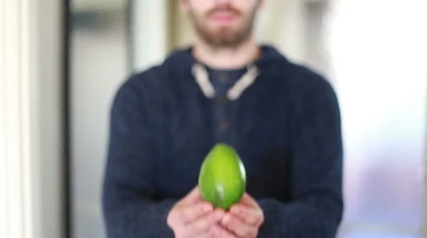 View of man hands holding avocado Stock Footage 59541768