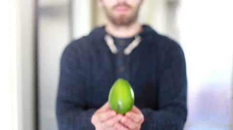 View of man hands holding avocado Stock Footage 59541769