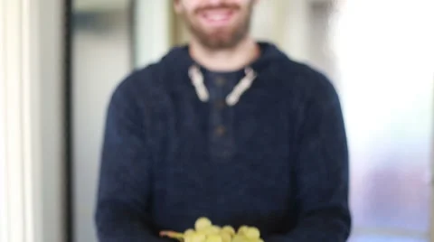 View of man hands holding bunch of green grapes Stock Footage 59541764