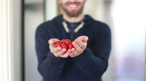 View of man hands holding cherry tomatoes Stock Footage 59541773