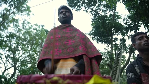 View of a man playing a traditional drum in Bogura, Bangladesh. Video stock 334988550