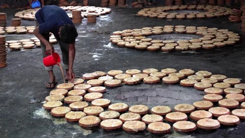 View of a man preparing traditional curd in Bogura, Bangladesh. Stock Footage 336426354