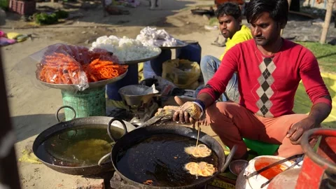View of a man preparing traditional sweets at a market, Nepal. Video stock 335475162