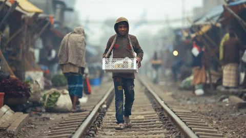 View of a man walking on railway tracks in Bogura, Bangladesh. Video stock 335551023