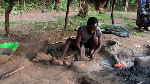 View of a man working as a traditional blacksmith, Ethiopia. Stock-Footage 343876810