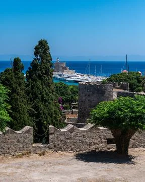 View of Mandraki Harbor and Saint Nicholas Fortress from Rhodes City Walls Stock Photos