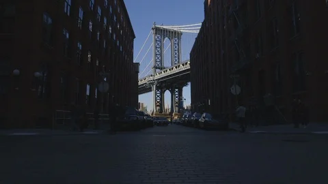 View of Manhattan Bridge from the Street between Buildings Stock Footage 121289793