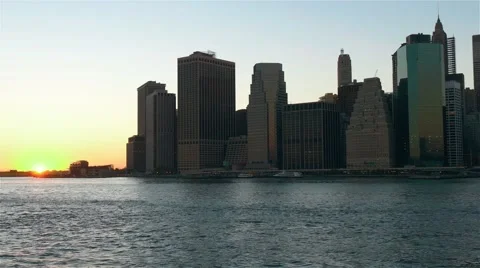 View of Manhattan skyline from Brooklyn at sunset. No camera movement. Stock Footage 62529029