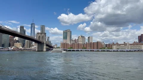 View of Manhattan skyline. NYC Ferry sails through the East River. New York Stock Footage 337837610