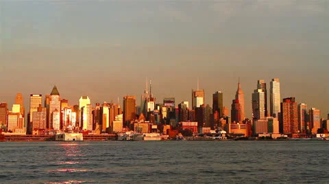 View of Manhattan skyline at sunset Stock Footage 22565324