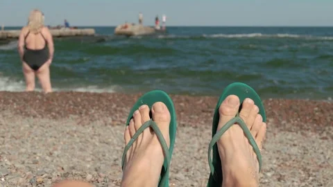 View Of A Man's Feet In Flip-Flops On Th... Stock Video Pond5