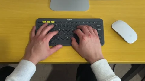 View of man's hands typing on a keyboard Stock Footage 267210616