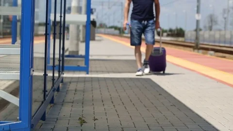 View of man's legs walking on the train station Stock Footage 78653341