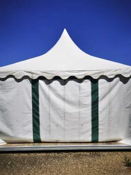 View of a marquee under a blue sky background Stock Photos