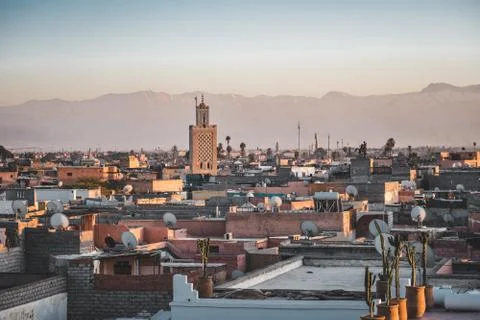 View Marrakech during sunset with the snow-covered Atlas mountains in the Stock Photos