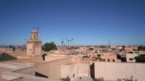 View of Marrakech skyline, rooftops and palm tree in a blue winter sky Video stock 150015608