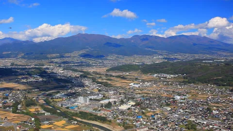 View of Maruko City, Mount Eboshi, and Mount Asama from the Ruins of Yoda Castle Stock Footage 330524386