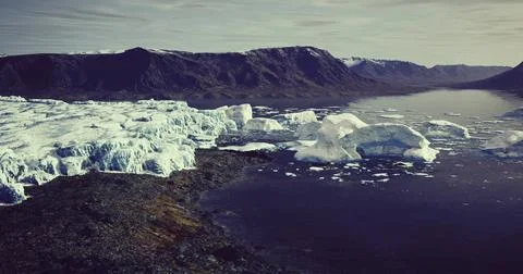 View of massive icebergs melting in a remote glacial fjord Stock Illustration