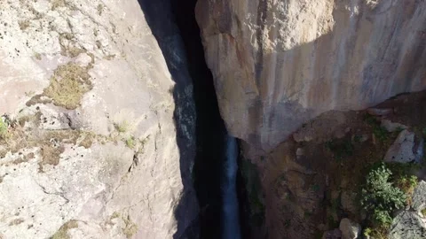 View of massive limestone rock wall and dark canyon cavern in Kazakhstan Stock Footage 338117354