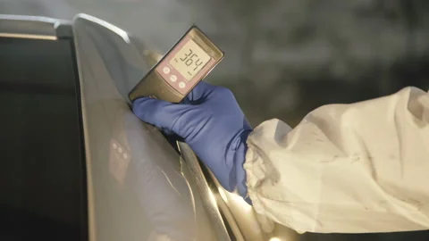 View of measuring a thickness of primer on a car surface using a thickness gauge Video stock 86422361
