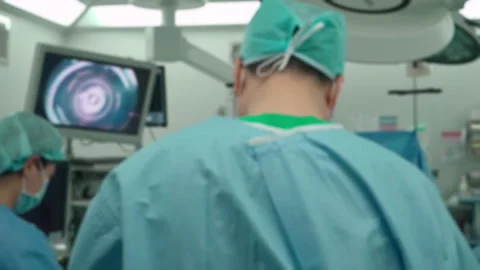 View of medical team performing surgery in modern hospital operating room Stock Footage 334851215