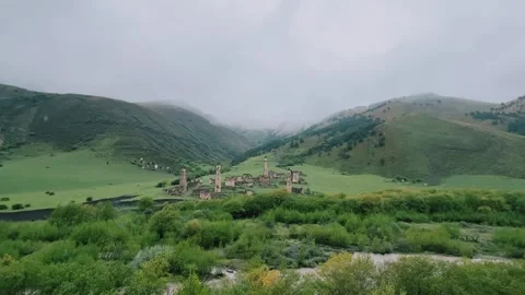 View of the medieval Targim tower complex in the Caucasus mountains Stock Footage 266287020