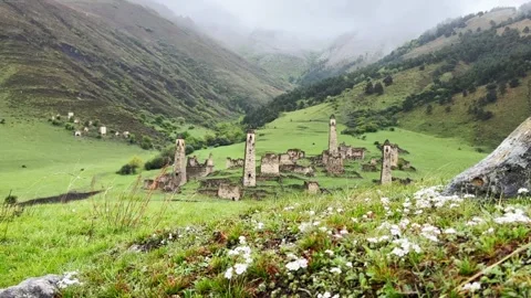 View of the medieval Targim tower complex in the Caucasus mountains Stock Footage 266294883