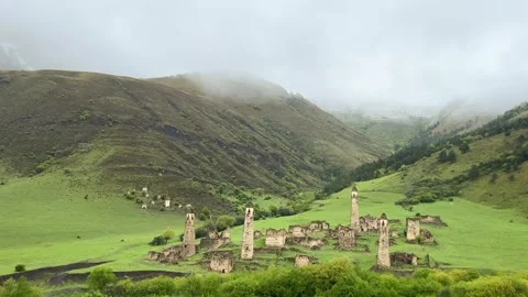 View of the medieval Targim tower complex in the Caucasus mountains Stock Footage 271149884