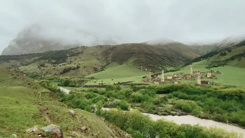 View of the medieval Targim tower complex in the Caucasus mountains Stock Footage 271150349