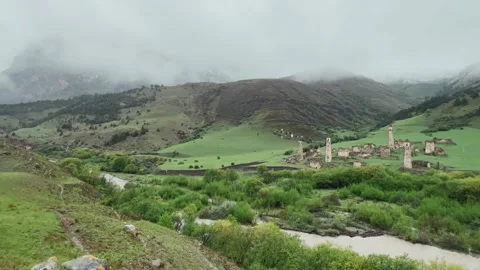 View of the medieval Targim tower complex in the Caucasus mountains Stock Footage 271150354