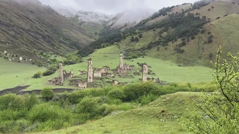 View of the medieval Targim tower complex in the Caucasus mountains Stock Footage 271150764