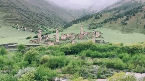 View of the medieval Targim tower complex in the Caucasus mountains Stock Footage 271150983
