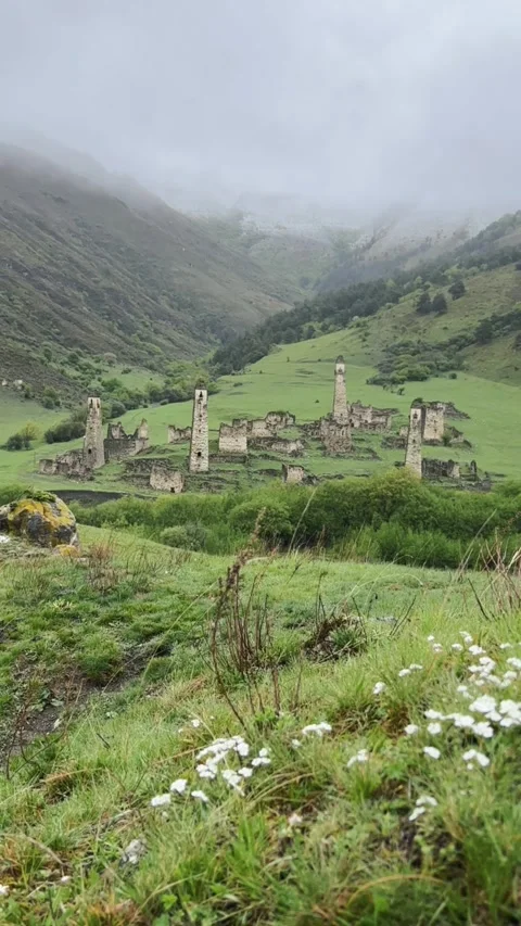 View of the medieval Targim tower complex in the Caucasus mountains Stock Footage 271151704