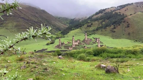 View of the medieval Targim tower complex in the Caucasus mountains Stock Footage 272508889