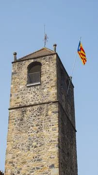 View of a medieval tower with the Catalan flag. Stock Photos