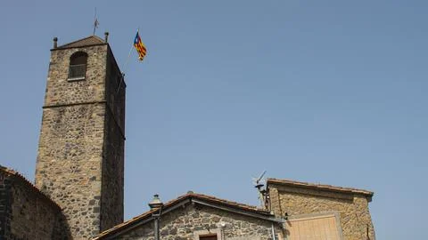 View of a medieval tower with the Catalan flag. Stock Photos