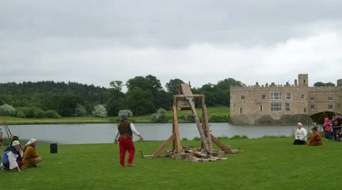 View of a medieval trebouchet shooting Stock Footage 64011456